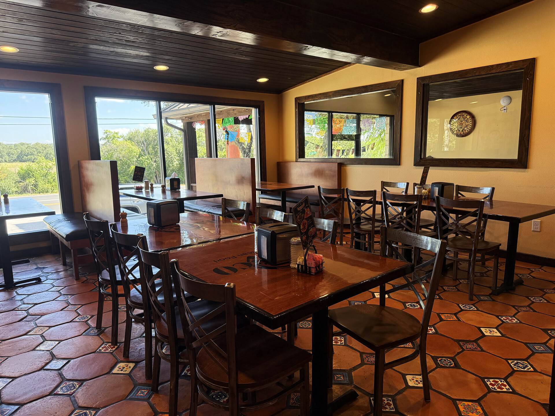 The main dining room, its wide windows opening onto the Hill Country